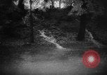 Image of rapid flowing water in streets United States USA, 1955, second 7 stock footage video 65675052615