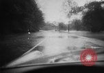 Image of rapid flowing water in streets United States USA, 1955, second 10 stock footage video 65675052615