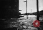 Image of rapid flowing water in streets United States USA, 1955, second 11 stock footage video 65675052615