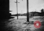 Image of rapid flowing water in streets United States USA, 1955, second 13 stock footage video 65675052615