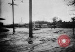 Image of rapid flowing water in streets United States USA, 1955, second 15 stock footage video 65675052615