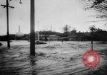 Image of rapid flowing water in streets United States USA, 1955, second 16 stock footage video 65675052615