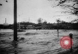 Image of rapid flowing water in streets United States USA, 1955, second 17 stock footage video 65675052615