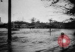 Image of rapid flowing water in streets United States USA, 1955, second 18 stock footage video 65675052615