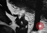 Image of rapid flowing water in streets United States USA, 1955, second 19 stock footage video 65675052615