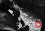 Image of rapid flowing water in streets United States USA, 1955, second 20 stock footage video 65675052615