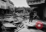 Image of rapid flowing water in streets United States USA, 1955, second 31 stock footage video 65675052615