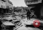 Image of rapid flowing water in streets United States USA, 1955, second 32 stock footage video 65675052615