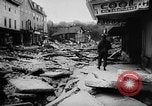 Image of rapid flowing water in streets United States USA, 1955, second 33 stock footage video 65675052615