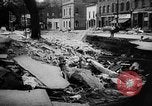 Image of rapid flowing water in streets United States USA, 1955, second 35 stock footage video 65675052615