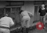 Standbild Männer außerhalb der Häuser Sierra Madre California USA, 1954, aus Sekunde 16 historischem Filmmaterial Videoclip 65675052625
