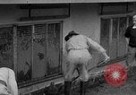 Standbild Männer außerhalb der Häuser Sierra Madre California USA, 1954, aus Sekunde 17 historischem Filmmaterial Videoclip 65675052625