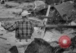 Standbild Männer außerhalb der Häuser Sierra Madre California USA, 1954, aus Sekunde 26 historischem Filmmaterial Videoclip 65675052625