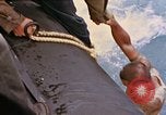 Image of US submarine rescues survivors from Japanese boat Pacific Ocean, 1945, second 7 stock footage video 65675052640