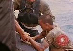 Image of US submarine rescues survivors from Japanese boat Pacific Ocean, 1945, second 11 stock footage video 65675052640