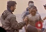 Image of US submarine rescues survivors from Japanese boat Pacific Ocean, 1945, second 21 stock footage video 65675052640