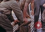 Image of US submarine rescues survivors from Japanese boat Pacific Ocean, 1945, second 28 stock footage video 65675052640