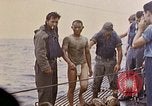 Image of US submarine rescues survivors from Japanese boat Pacific Ocean, 1945, second 32 stock footage video 65675052640