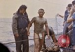 Image of US submarine rescues survivors from Japanese boat Pacific Ocean, 1945, second 33 stock footage video 65675052640
