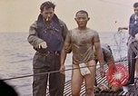 Image of US submarine rescues survivors from Japanese boat Pacific Ocean, 1945, second 34 stock footage video 65675052640