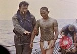 Image of US submarine rescues survivors from Japanese boat Pacific Ocean, 1945, second 35 stock footage video 65675052640