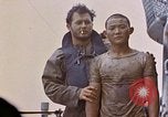 Image of US submarine rescues survivors from Japanese boat Pacific Ocean, 1945, second 40 stock footage video 65675052640