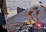 Image of US submarine rescues survivors from Japanese boat Pacific Ocean, 1945, second 49 stock footage video 65675052640