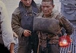 Image of US submarine rescues survivors from Japanese boat Pacific Ocean, 1945, second 61 stock footage video 65675052640