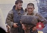 Image of US submarine rescues survivors from Japanese boat Pacific Ocean, 1945, second 62 stock footage video 65675052640