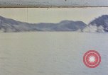 Image of US submarine firing 5 inch guns at targets in Japanese waters Japan, 1945, second 1 stock footage video 65675052641