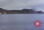 Image of US submarine firing 5 inch guns at targets in Japanese waters Japan, 1945, second 19 stock footage video 65675052641