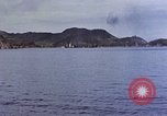 Image of US submarine firing 5 inch guns at targets in Japanese waters Japan, 1945, second 23 stock footage video 65675052641