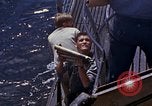 Image of US submarine firing 5 inch guns at targets in Japanese waters Japan, 1945, second 27 stock footage video 65675052641