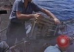 Image of US submarine firing 5 inch guns at targets in Japanese waters Japan, 1945, second 31 stock footage video 65675052641