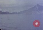 Image of US submarine firing 5 inch guns at targets in Japanese waters Japan, 1945, second 32 stock footage video 65675052641