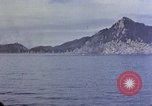 Image of US submarine firing 5 inch guns at targets in Japanese waters Japan, 1945, second 33 stock footage video 65675052641