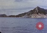 Image of US submarine firing 5 inch guns at targets in Japanese waters Japan, 1945, second 35 stock footage video 65675052641