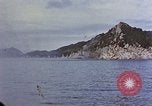 Image of US submarine firing 5 inch guns at targets in Japanese waters Japan, 1945, second 37 stock footage video 65675052641