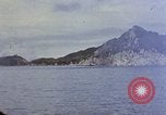 Image of US submarine firing 5 inch guns at targets in Japanese waters Japan, 1945, second 39 stock footage video 65675052641