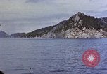Image of US submarine firing 5 inch guns at targets in Japanese waters Japan, 1945, second 42 stock footage video 65675052641