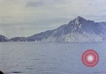 Image of US submarine firing 5 inch guns at targets in Japanese waters Japan, 1945, second 44 stock footage video 65675052641