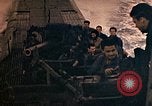 Image of US submarine firing 5 inch guns at targets in Japanese waters Japan, 1945, second 53 stock footage video 65675052641