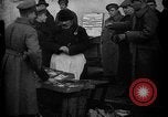 Image of US soldiers visit an open air market Archangel Russia, 1918, second 62 stock footage video 65675053036