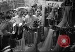 Image of women buying silk stockings during war ration United States USA, 1942, second 7 stock footage video 65675053064