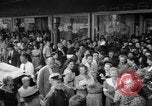 Image of women buying silk stockings during war ration United States USA, 1942, second 13 stock footage video 65675053064