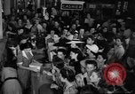 Image of women buying silk stockings during war ration United States USA, 1942, second 15 stock footage video 65675053064