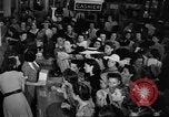 Image of women buying silk stockings during war ration United States USA, 1942, second 16 stock footage video 65675053064