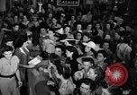 Image of women buying silk stockings during war ration United States USA, 1942, second 17 stock footage video 65675053064
