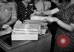 Image of women buying silk stockings during war ration United States USA, 1942, second 20 stock footage video 65675053064
