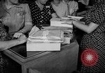 Image of women buying silk stockings during war ration United States USA, 1942, second 22 stock footage video 65675053064